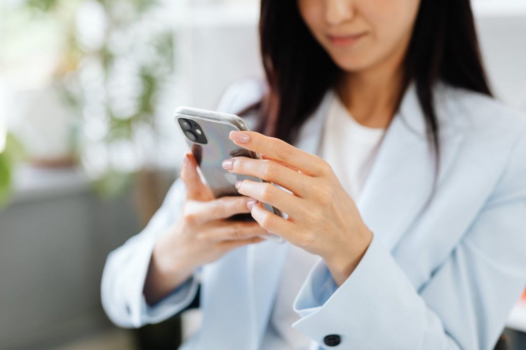 Woman Browsing Her Smartphone